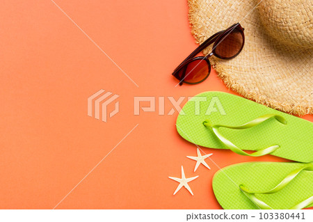 Summer vacation concept flat lay. straw hat beach accessories and towel top view. Space for text. travel concept 103380441