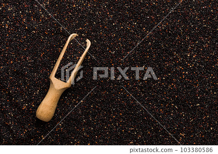 black quinoa grain in wooden spoon background and texture of gluten free top view 103380586