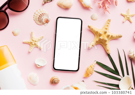Flat lay composition with Phone and beach accessories on colored background. Smartphone with blank screen mock up with copy space 103380741