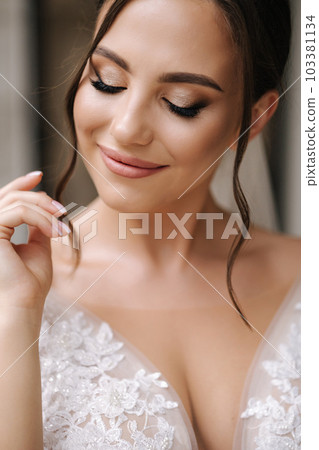 Close-up portrait of elegant woman in luxury wedding dress. Bride morning concept 103381134