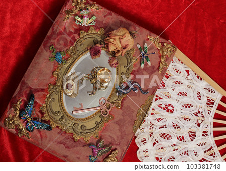 Antique Book With Colorful Gemstones and Mirror. Fairy Tale Romance Book Antique Book With Colorful Gemstones and Mirror. Fairy Tale Romance Book 103381748