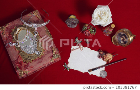 Paint Brush on Old Paper With Dried Flowers and Locket Paint Brush on Old Paper With Dried Flowers and Locket 103381767