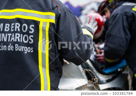 Car Crash Traffic Accident. Firefighters Rescue Injured Trapped Victims. Firemen give First Aid to Car Crash Traffic Accident. Firefighters Rescue Injured Trapped Victims. Firemen give First Aid to 103381784