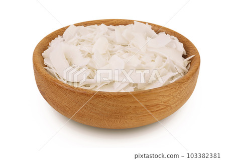 Coconut flakes or chips in wooden bowl isolated on white background with full depth of field Coconut flakes or chips in wooden bowl isolated on white background with full depth of field 103382381