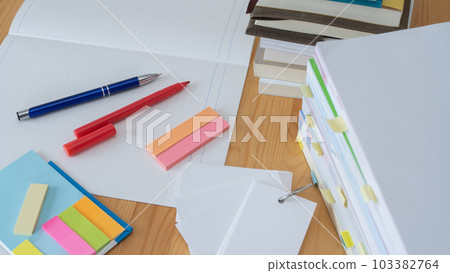 Stacked books and notes/study image 103382764