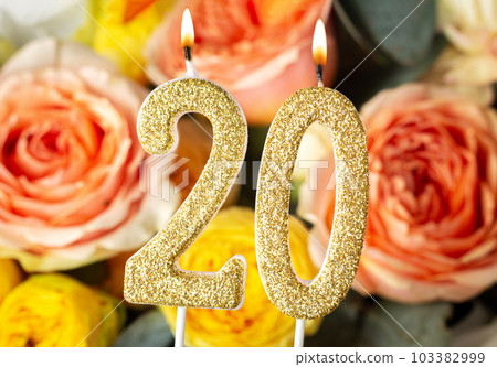 Burning birthday candles number 20 background 103382999