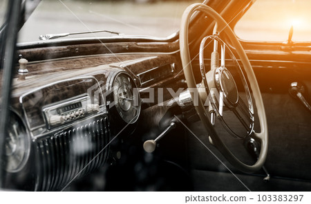 Steering wheel of a classic automobile. Steering wheel of a classic automobile. 103383297