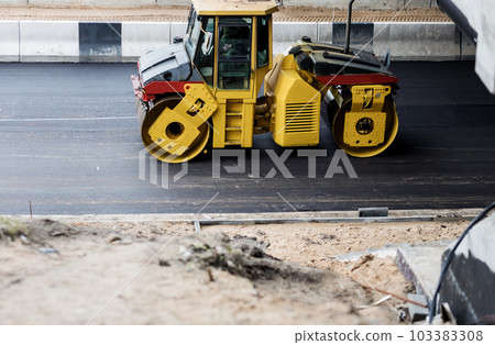 Asphalt paver machine on road 103383308