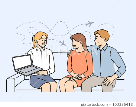 Tour operator showing offer on laptop to clients  103386418