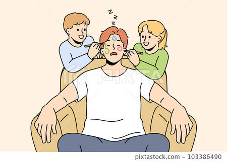 Naughty smiling children draw on sleeping father face Naughty smiling children draw on sleeping father face 103386490