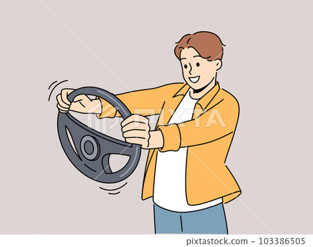 Smiling man with steering wheel in hands  103386505
