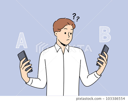 Confused man compare different smartphones Confused man compare different smartphones 103386554