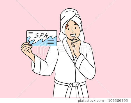 Smiling woman with spa voucher in hands Smiling woman with spa voucher in hands 103386593