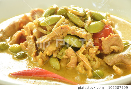 spicy boiled pork and Nitta tree seed or luk rieng in coconut milk curry soup Thai southern food on plate spicy boiled pork and Nitta tree seed or luk rieng in coconut milk curry soup Thai southern food on plate 103387399