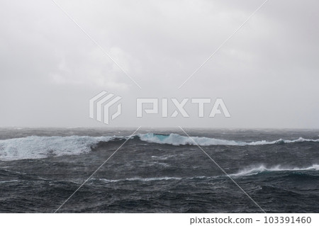 Beautiful seascape - waves and sky with clouds with beautiful lighting. Stormy sea, Bad weather. Gale. Rough sea. Beautiful seascape - waves and sky with clouds with beautiful lighting. Stormy sea, Bad weather. Gale. Rough sea. 103391460
