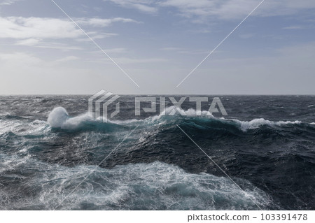 Beautiful seascape - waves and sky with clouds with beautiful lighting. Stormy sea, Bad weather. Gale. Rough sea. Beautiful seascape - waves and sky with clouds with beautiful lighting. Stormy sea, Bad weather. Gale. Rough sea. 103391478