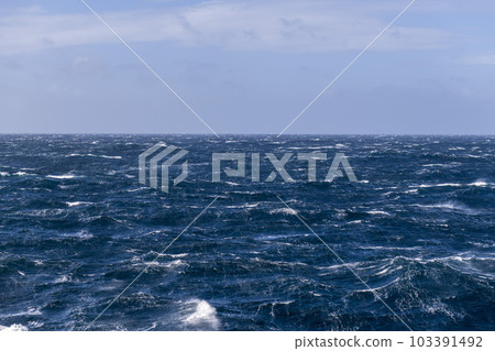 Beautiful seascape - waves and sky with clouds with beautiful lighting. Stormy sea, Bad weather. Gale. Rough sea. Beautiful seascape - waves and sky with clouds with beautiful lighting. Stormy sea, Bad weather. Gale. Rough sea. 103391492