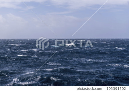 Beautiful seascape - waves and sky with clouds with beautiful lighting. Stormy sea, Bad weather. Gale. Rough sea. 103391502