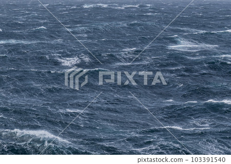 Beautiful seascape - waves and sky with clouds with beautiful lighting. Stormy sea, Bad weather. Gale. Rough sea. Beautiful seascape - waves and sky with clouds with beautiful lighting. Stormy sea, Bad weather. Gale. Rough sea. 103391540