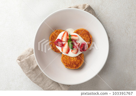 Portion of russian syrniki pancakes breakfast 103391767