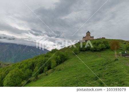 Gergeti Trinity Church near the Stepantsminda village in Georgia ,At an altitude of 2170 meters, under Mount Kazbek or Kazbegi, Gergeti Trinity Church near the Stepantsminda village in Georgia ,At an altitude of 2170 meters, under Mount Kazbek or Kazbegi, 103393079