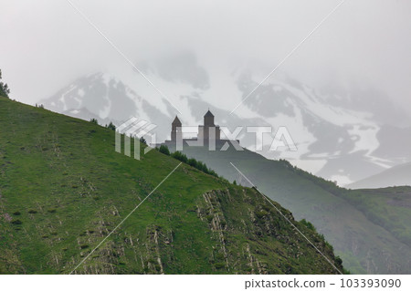 Gergeti Trinity Church near the Stepantsminda village in Georgia ,At an altitude of 2170 meters, under Mount Kazbek or Kazbegi, Gergeti Trinity Church near the Stepantsminda village in Georgia ,At an altitude of 2170 meters, under Mount Kazbek or Kazbegi, 103393090