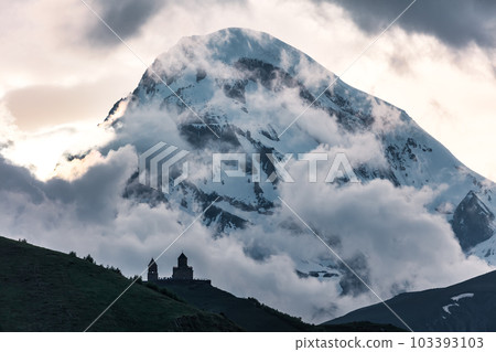 Gergeti Trinity Church near the Stepantsminda village in Georgia ,At an altitude of 2170 meters, under Mount Kazbek or Kazbegi, Gergeti Trinity Church near the Stepantsminda village in Georgia ,At an altitude of 2170 meters, under Mount Kazbek or Kazbegi, 103393103