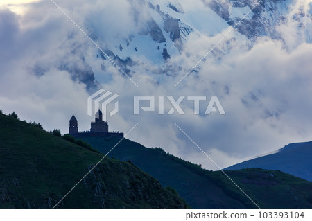 Gergeti Trinity Church near the Stepantsminda village in Georgia ,At an altitude of 2170 meters, under Mount Kazbek or Kazbegi, Gergeti Trinity Church near the Stepantsminda village in Georgia ,At an altitude of 2170 meters, under Mount Kazbek or Kazbegi, 103393104