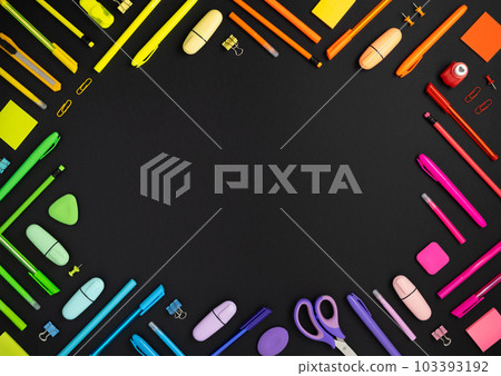 Frame of colorful rainbow school and office stationery set on black back Frame of colorful rainbow school and office stationery set on black back 103393192