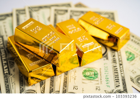 Gold bar on US dollar banknotes money, economy finance exchange trade investment concept. 103393236