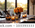 Halloween table setting with pumpkins and skulls 103393333