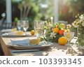 Romantic table setting with candles and flowers 103393345