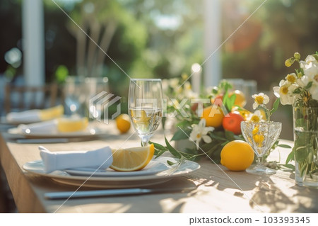 Romantic table setting with candles and flowers 103393345