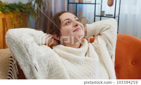 Tired lazy woman enjoy relaxing on home sofa resting napping after hard working day, closed her eyes 103394259