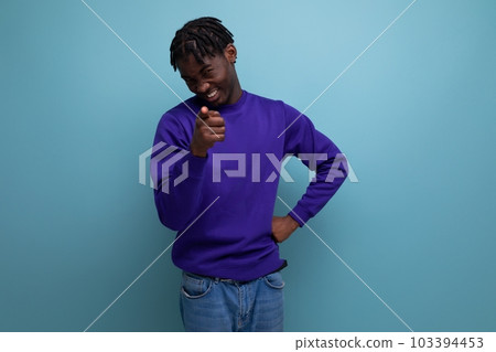 pensive dark-skinned african young man with dreadlocks in casual clothes 103394453