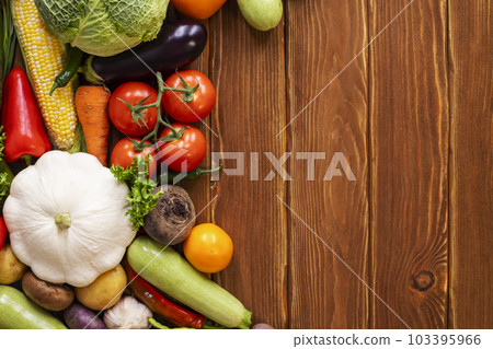 Assortment of fresh ripe vegetables on wooden background with space for text. Assortment of fresh ripe vegetables on wooden background with space for text. 103395966