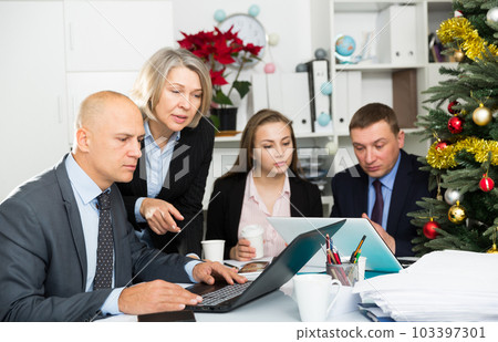 Business people developing strategy for teamwork in modern office with laptop 103397301