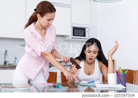 Mother taking away smartphone 103397504