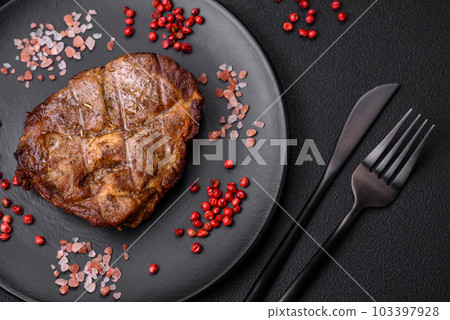 Delicious juicy pork or beef steak grilled with salt, spices and herbs Delicious juicy pork or beef steak grilled with salt, spices and herbs 103397928