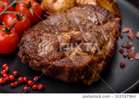 Delicious juicy pork or beef steak grilled with salt, spices and herbs Delicious juicy pork or beef steak grilled with salt, spices and herbs 103397964