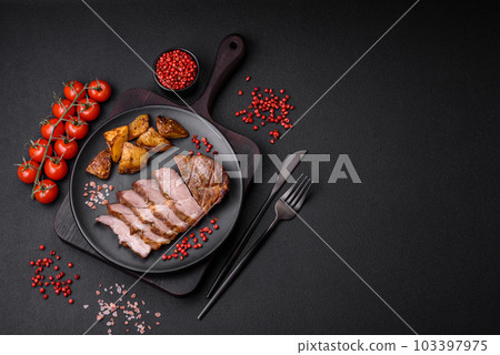 Delicious juicy pork or beef steak grilled with salt, spices and herbs Delicious juicy pork or beef steak grilled with salt, spices and herbs 103397975
