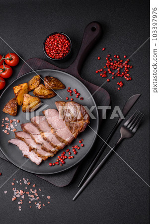 Delicious juicy pork or beef steak grilled with salt, spices and herbs 103397976