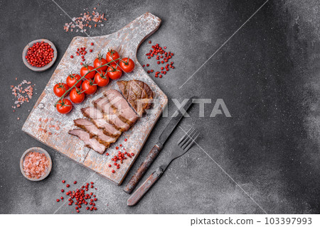 Delicious juicy pork or beef steak grilled with salt, spices and herbs 103397993