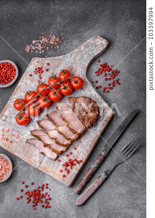 Delicious juicy pork or beef steak grilled with salt, spices and herbs 103397994