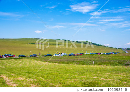 A field and a blue sky that stretches into the distance A field and a blue sky that stretches into the distance 103398546
