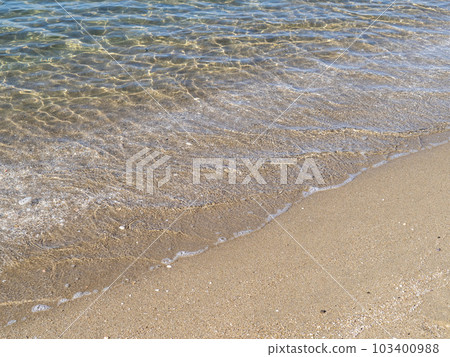 The beach on the sandy beach of the transparent and beautiful sea. The beach on the sandy beach of the transparent and beautiful sea. 103400988
