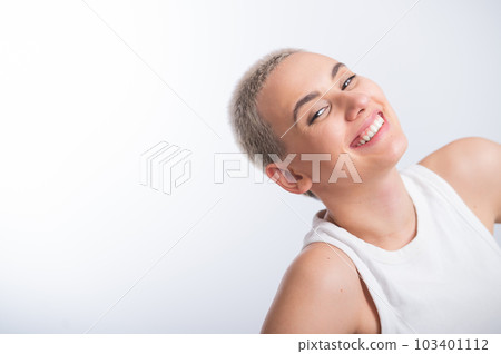 Beautiful young caucasian woman with a short haircut on a white background. Beautiful young caucasian woman with a short haircut on a white background. 103401112