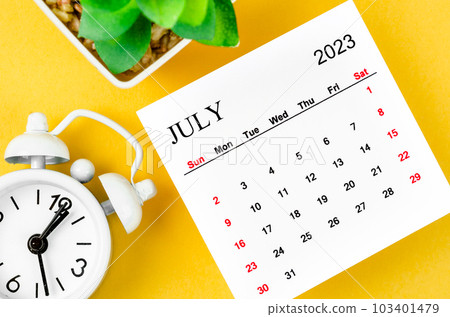The July 2023 Monthly calendar for 2023 year with alarm clock on yellow background. The July 2023 Monthly calendar for 2023 year with alarm clock on yellow background. 103401479