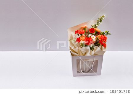 Bouquet of flowers in a vase on a white background	 103401758