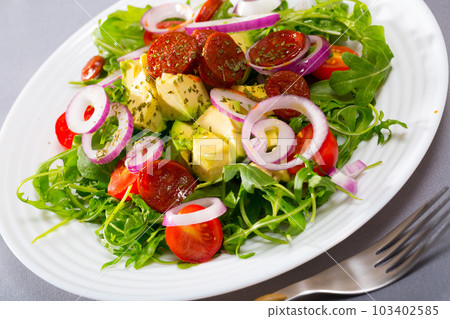 Arugula salad with avocado, roasted chorizo sausage Arugula salad with avocado, roasted chorizo sausage 103402585
